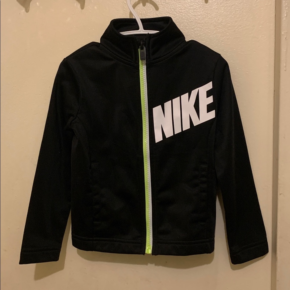 Toddler’s Nike black and white nylon jacket with neon zipper, size 2T.